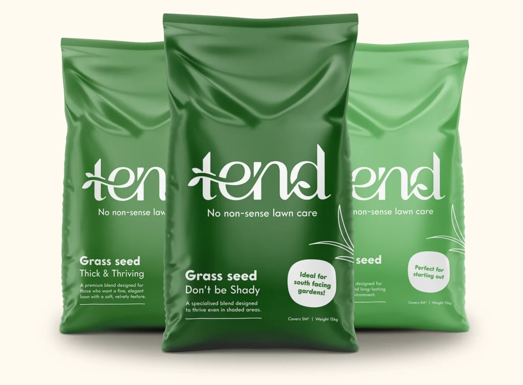 3 bags of grass seed with the Tend logo